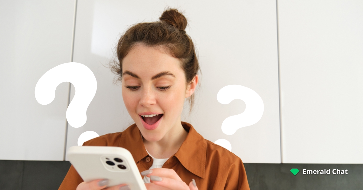 A woman holding her phone and looks happy