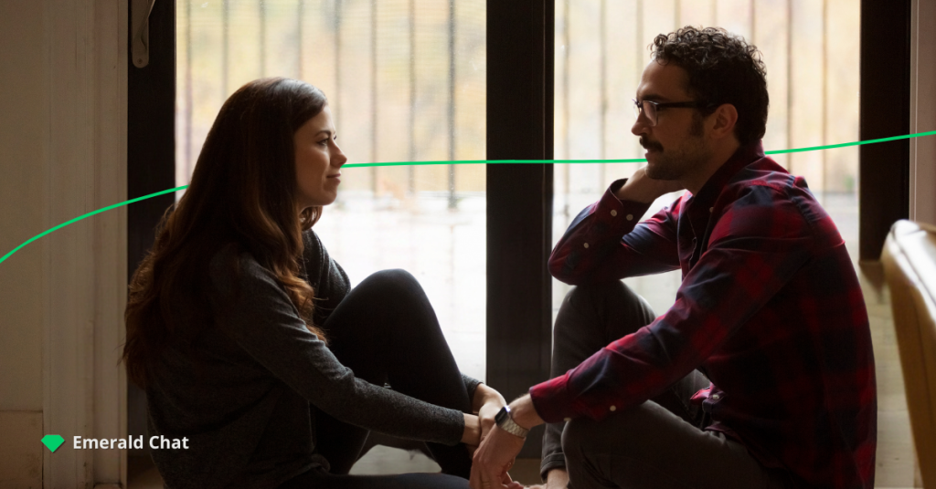 A couple sitting and facing  to each other