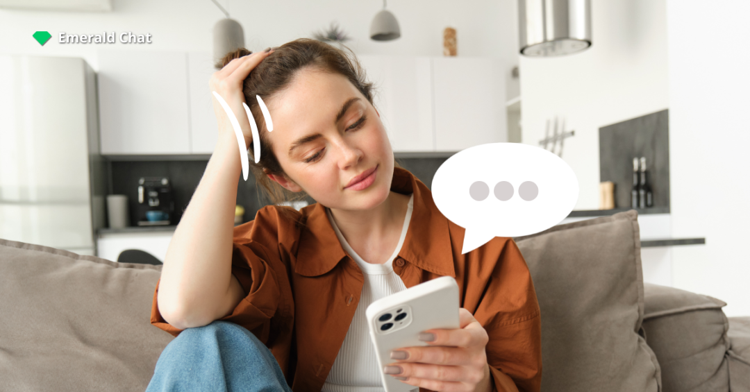 A woman sitting on a couch, looking thoughtful while holding her phone, with a chat bubble icon showing three dots to represent conversation struggles.