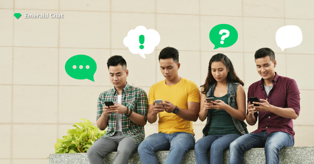 Four young adults sitting side by side while using their phones, surrounded by colorful chat bubbles, representing modern online chat rooms and digital conversations on Emerald Chat.