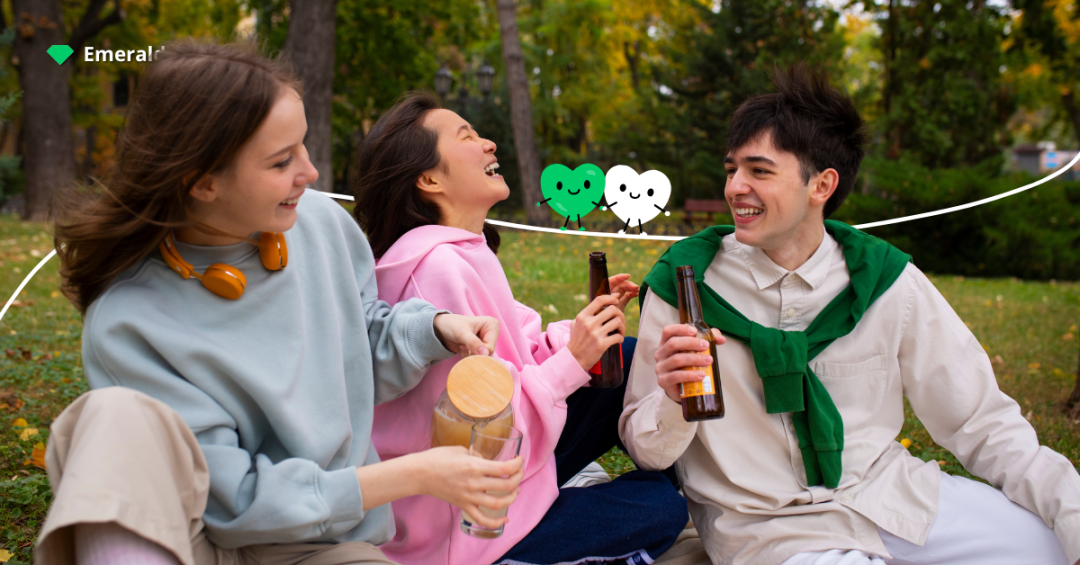 Group of friends enjoying a relaxed moment outdoors, representing how rare interactions can still lead to falling for someone you barely talk to