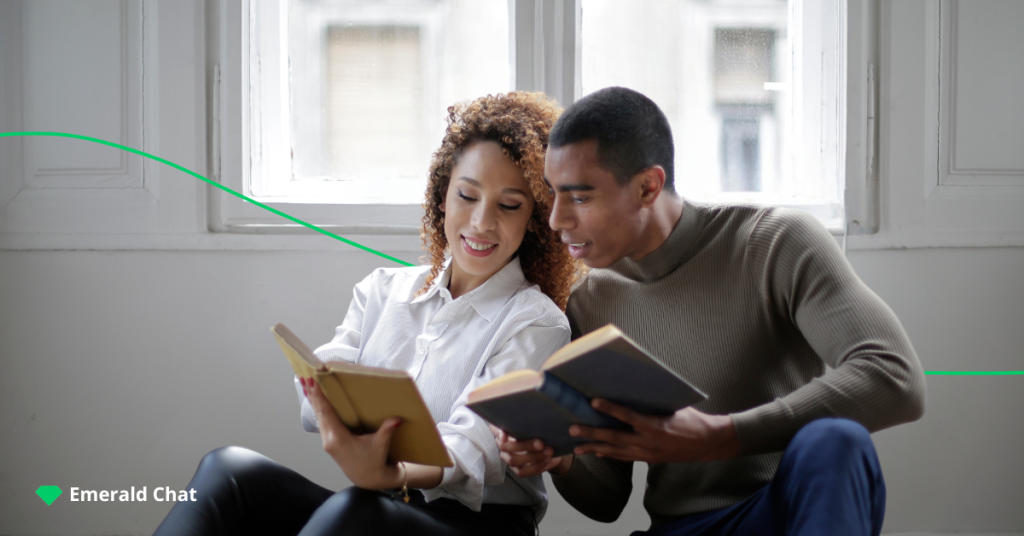 image of a female and male holding a book