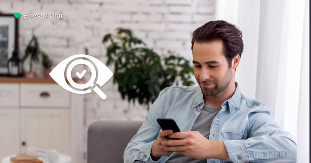 A man sitting in a bright living room while browsing on his phone, with a magnifying glass and checkmark icon symbolizing transparency in AI moderation.