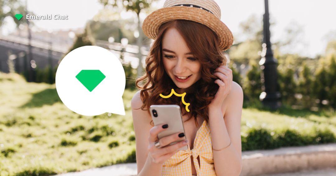 Woman smiling at her phone outdoors, capturing how online chats can lead to falling for someone you barely talk to