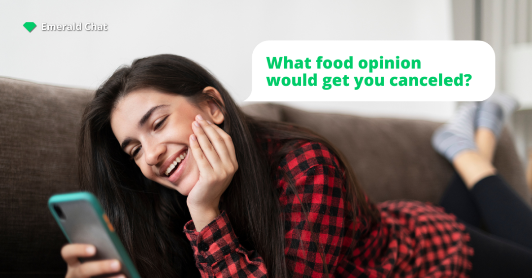 A smiling girl lies on a couch looking at her phone with a chat bubble asking “What food opinion would get you canceled?” and the Emerald Chat logo in the corner.